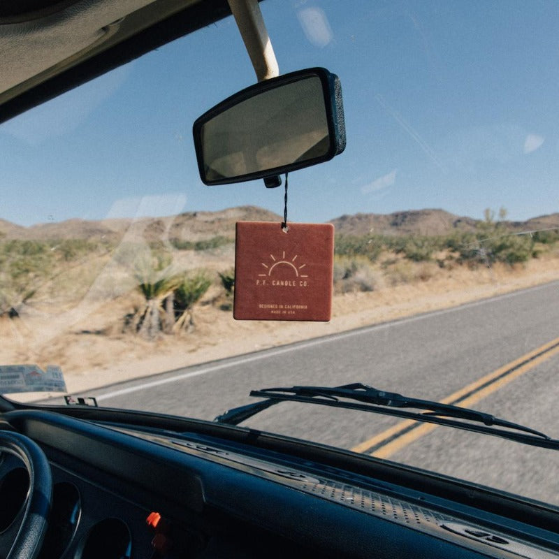 P.F. Candle Co. Wholesale - Teakwood & Tobacco Classic Car Fragrance - Lifestyle 2 - Inspired by nostalgia, our love of road trips, and the power of scent to make anywhere – even the car – feel like home.