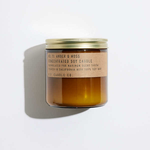 P.F. Candle Co. Wholesale Amber & Moss Large Concentrated Candle - Product - Hand-poured into apothecary inspired amber jars with our signature kraft label and a brass lid.