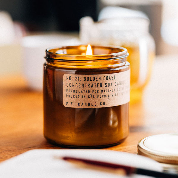 P.F. Candle Co. Wholesale Golden Coast Large Concentrated Candle - Lifestyle - Big Sur magic, wild sage baking in the sun, the rumble of waves and rocks. Notes of eucalyptus, sea salt, redwood, and palo santo.