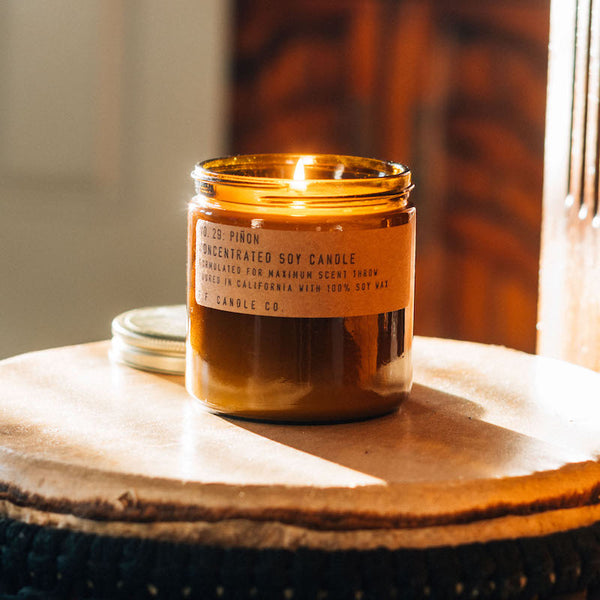 P.F. Candle Co. Wholesale Piñon Large Concentrated Candle -  Lifestyle - Winters in the Southwest, lingering bonfires, wool jackets in rotation. Notes of piñon logs, cedar, and vanilla.