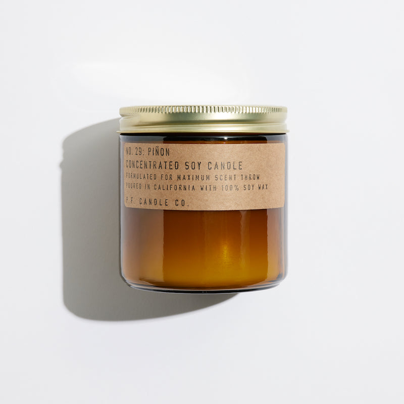 P.F. Candle Co. Wholesale Piñon Large Concentrated Candle - Product - Hand-poured into apothecary inspired amber jars with our signature kraft label and a brass lid.