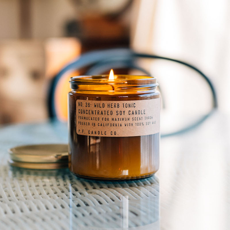 P.F. Candle Co. Wholesale Wild Herb Tonic Large Concentrated Candle - Lifestyle - Barefoot walks through wild herb gardens, cool mountain stream baths, crisp morning air. Aromatic, camphorous, earthy. Notes of lemon balm, crushed thyme, orange rind, and fir.
