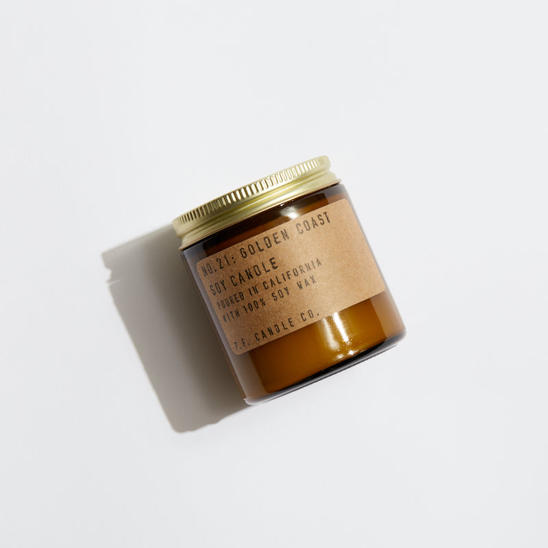 P.F. Candle Co. Wholesale - Golden Coast Classic 3.5 oz Mini Scented Soy Wax Candle - Product - Hand-poured into apothecary inspired amber jars with our signature kraft label and a brass lid.