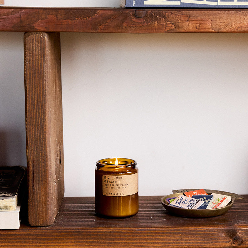 P.F. Candle Co. Wholesale Piñon Standard Candle - Lifestyle - with scent notes of piñon logs, cedar, and vanilla