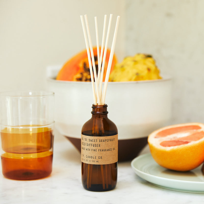 P.F. Candle Co. Wholesale Sweet Grapefruit Reed Diffuser - Lifestyle - Ice cold lemonade. Dinner on the patio with your favorite people. Grapefruit, yuzu, and lemon