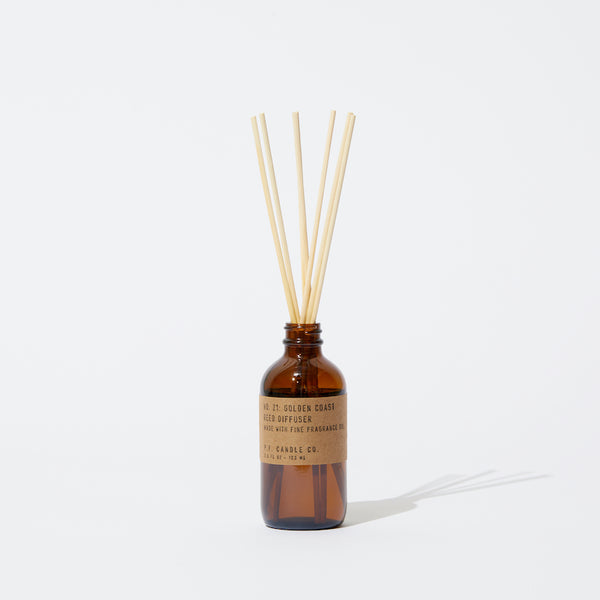 P.F. Candle Co. Wholesale Golden Coast Reed Diffuser - Product - Apothecary-inspired amber glass bottles with our signature kraft label and rattan reeds