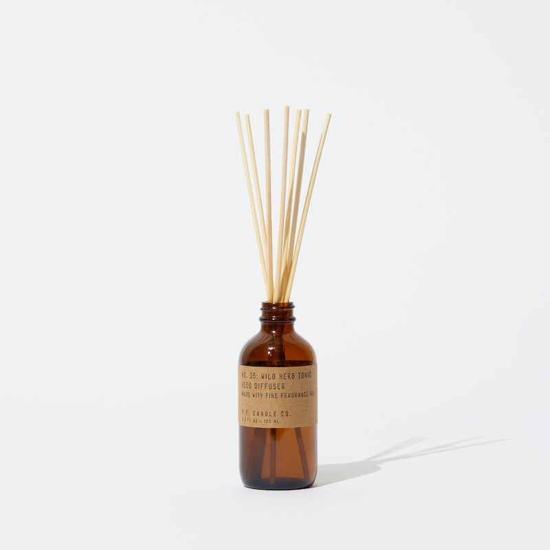 P.F. Candle Co. Wholesale - Wild Herb Tonic Classic 3.5 fl oz Scented Reed Diffuser - Product - Apothecary-inspired amber glass bottles with our signature kraft label and rattan reeds. Low-maintenance scent throw, all day long - no match necessary.