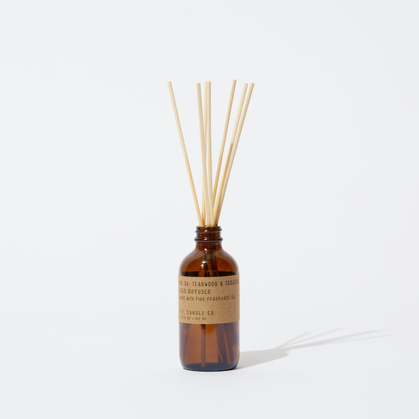 P.F. Candle Co. Wholesale Teakwood & Tobacco Reed Diffuser - Product - Packaged in apothecary-inspired amber glass bottles with our signature kraft label and rattan reeds. Low-maintenance scent throw, all day long - no match necessary.