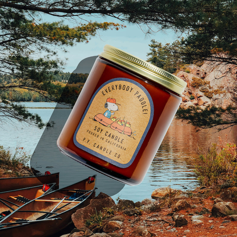 P.F. Candle Co. Wholesale Everybody Paddle! for Peanuts Standard Candle - Lifestyle - Inspired by afternoon sunlight glimmering on the water and wading through creeks with friends, Everybody Paddle! features aquatic, earthy notes of river moss, bay laurel, and wild fern to brighten your space and bring the outdoors in.