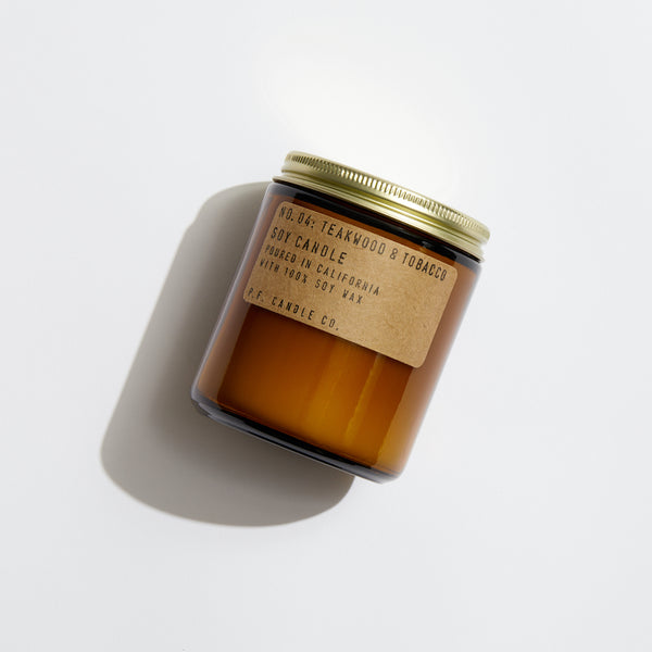 P.F. Candle Co. Wholesale Teakwood & Tobacco Standard Candle - Product - Hand-poured into apothecary inspired amber jars with our signature kraft label and a brass lid.
